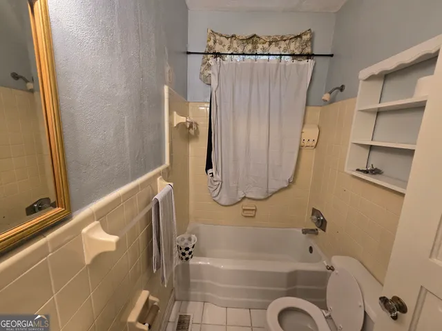 a bathroom with a shower and a tub