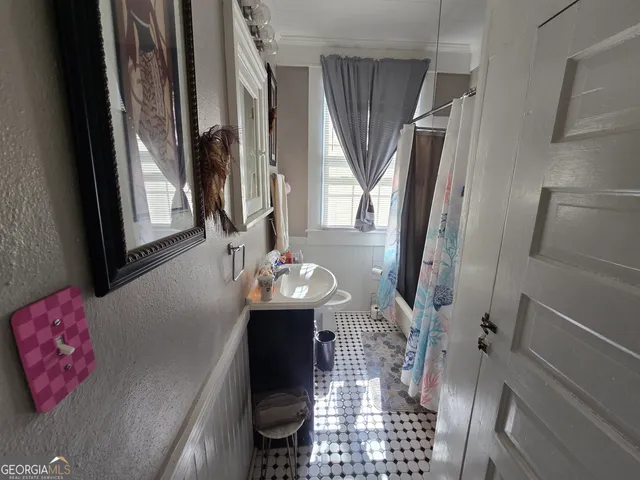 a view of living room with furniture and window