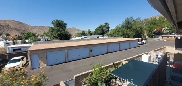a view of city from balcony having outdoor seating