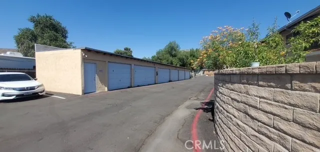 a view of a street with a car parked beside of it