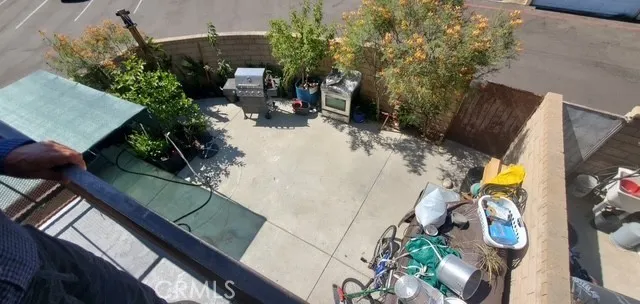 a view of yard from deck with patio
