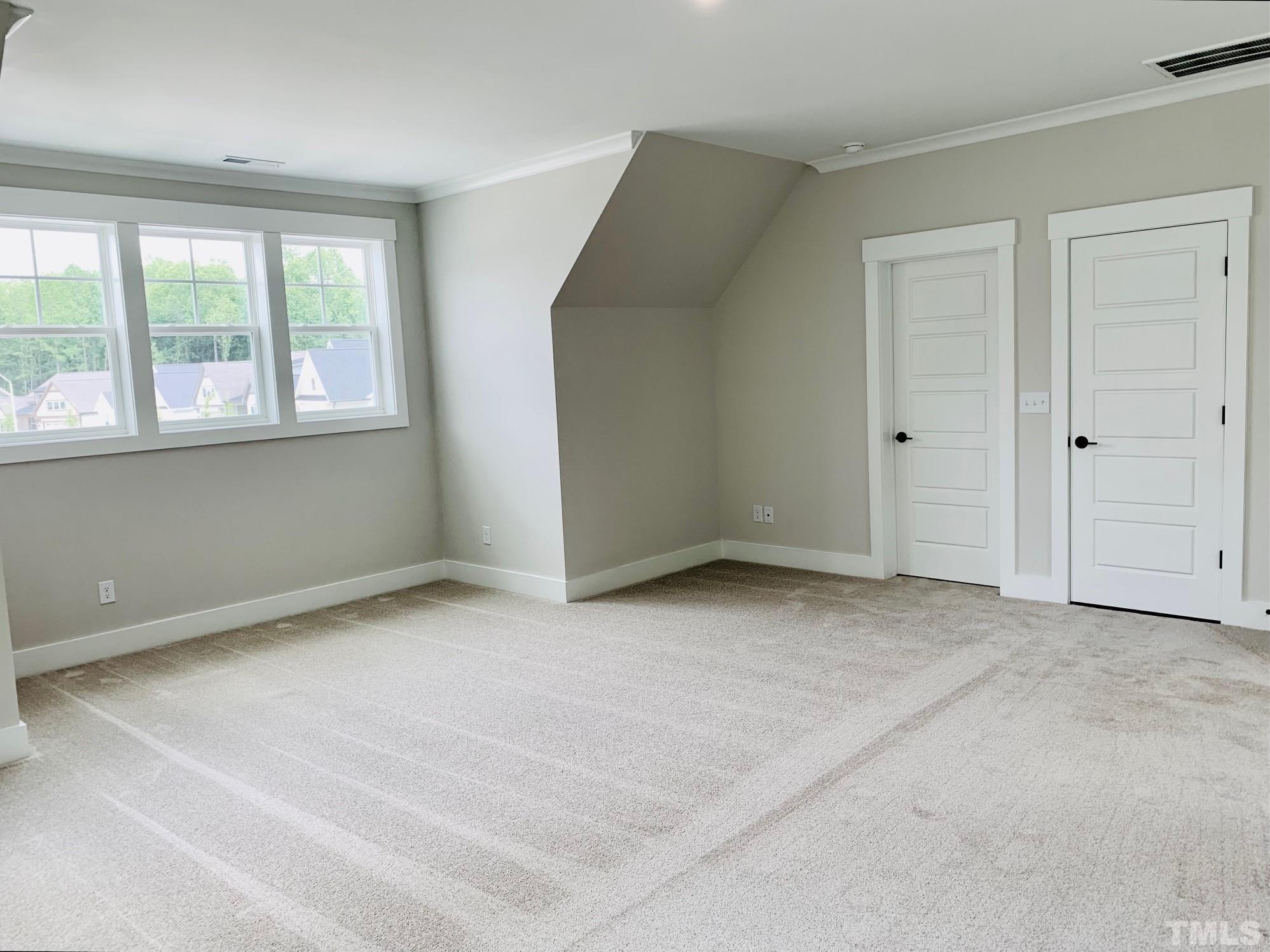 163 DUNLOE Loop Raleigh, NC 27603 - Photo 13 of 32 an empty room with windows