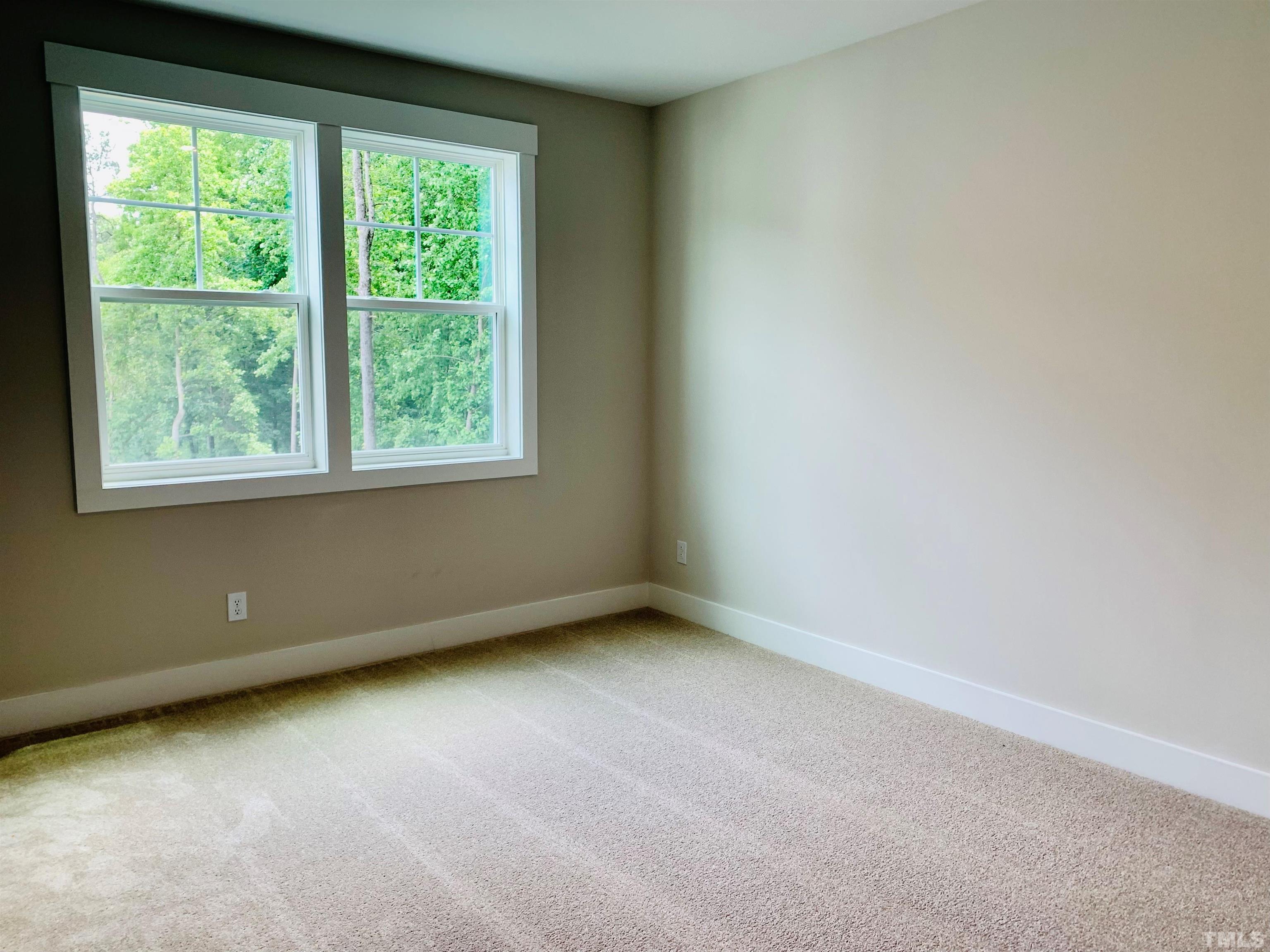 163 DUNLOE Loop Raleigh, NC 27603 - Photo 19 of 32 an empty room with a window