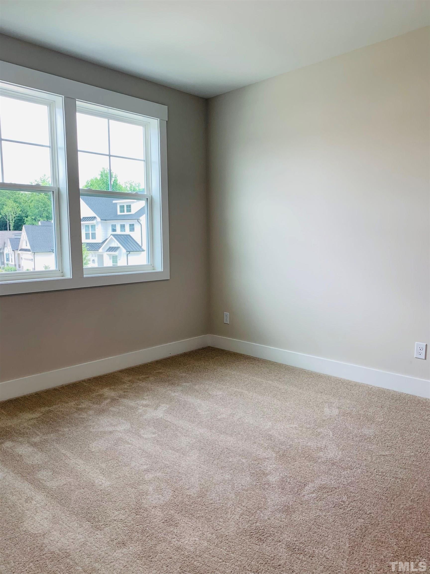 163 DUNLOE Loop Raleigh, NC 27603 - Photo 21 of 32 an empty room with a window