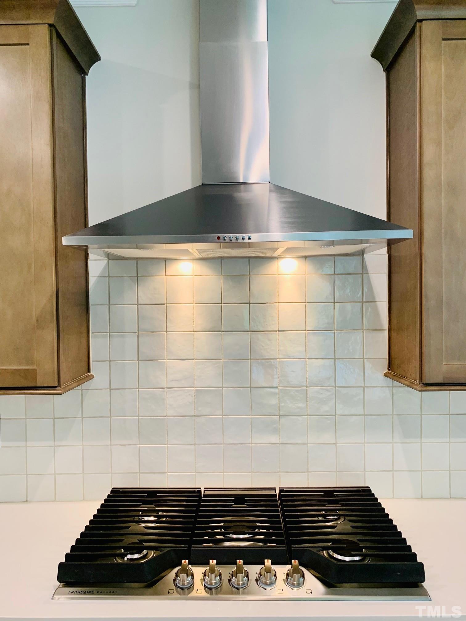 163 DUNLOE Loop Raleigh, NC 27603 - Photo 6 of 32 a close view of a stove a microwave and cabinets in the kitchen