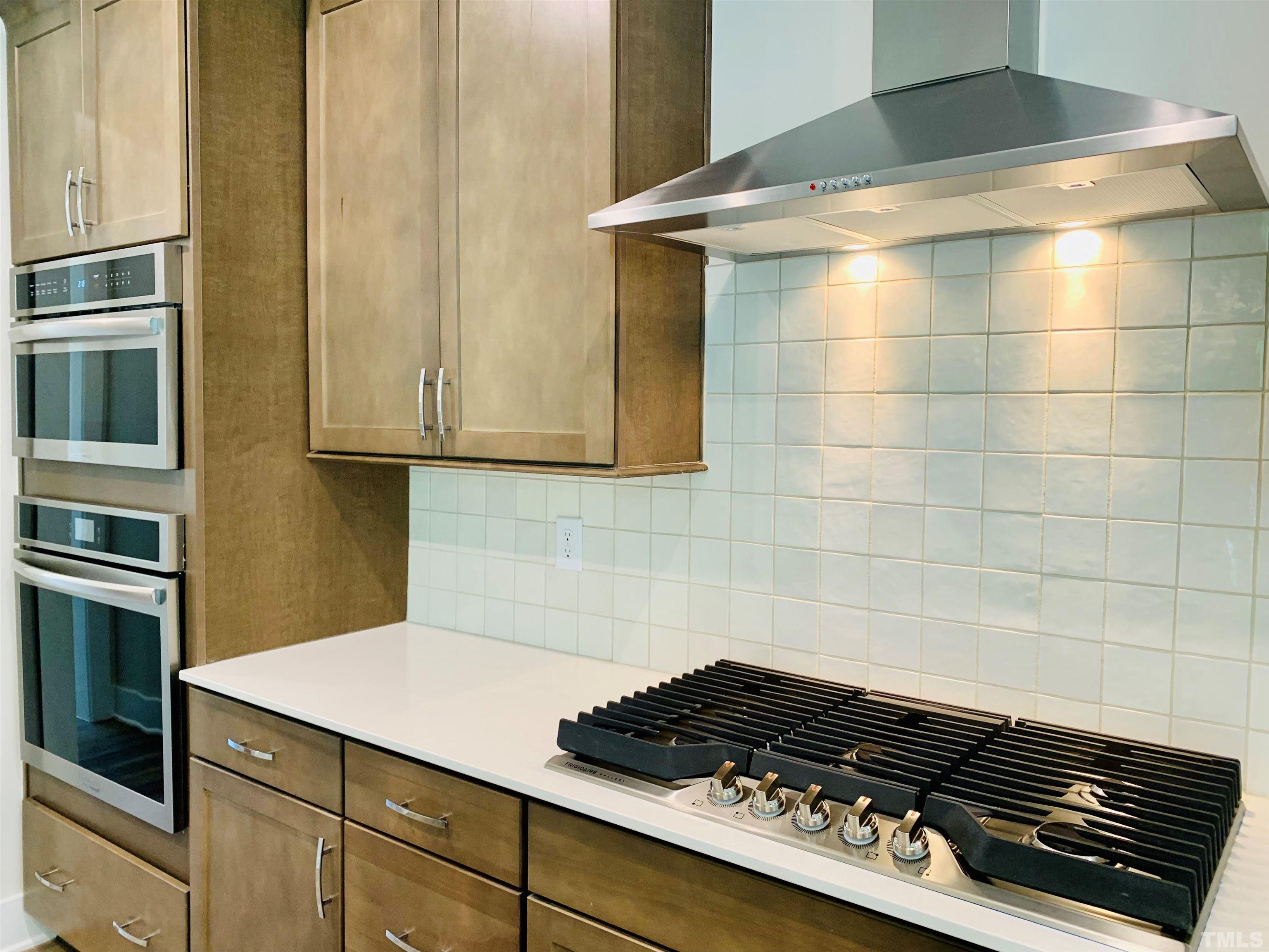163 DUNLOE Loop Raleigh, NC 27603 - Photo 9 of 32 a kitchen with a stove and a cabinets