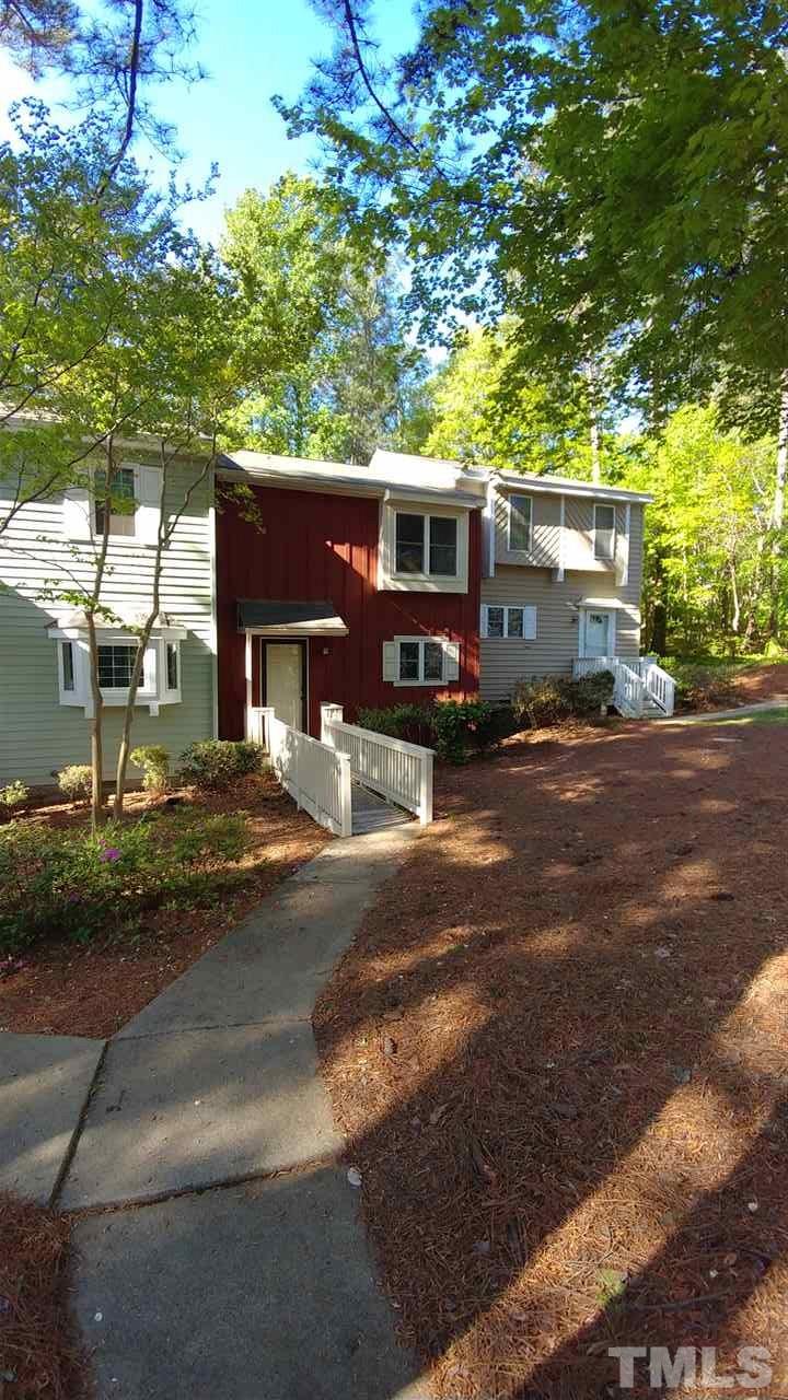 5742 Pool Side Drive Raleigh, NC 27612 - Photo 2 of 13 a front view of a house with a yard