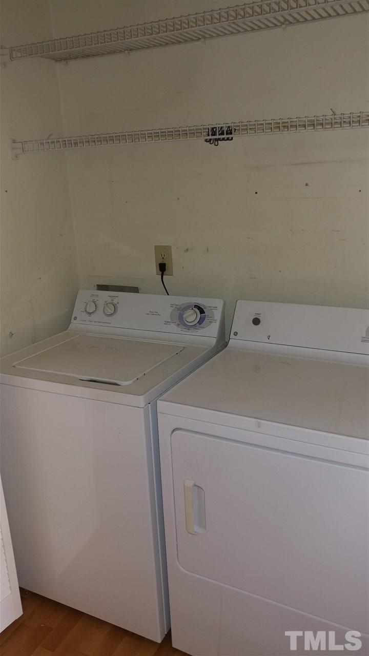 5742 Pool Side Drive Raleigh, NC 27612 - Photo 8 of 13 a utility room with dryer and washer