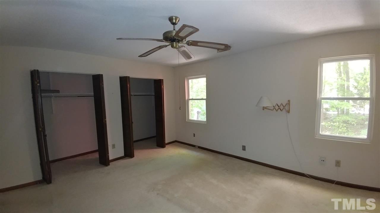 5742 Pool Side Drive Raleigh, NC 27612 - Photo 10 of 13 a view of an empty room with a window