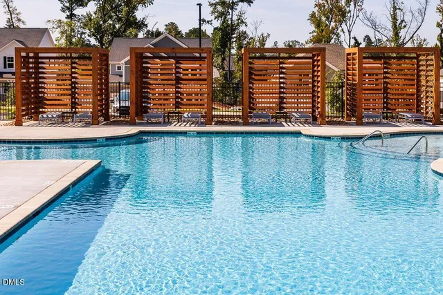 swimming pool view with outdoor seating