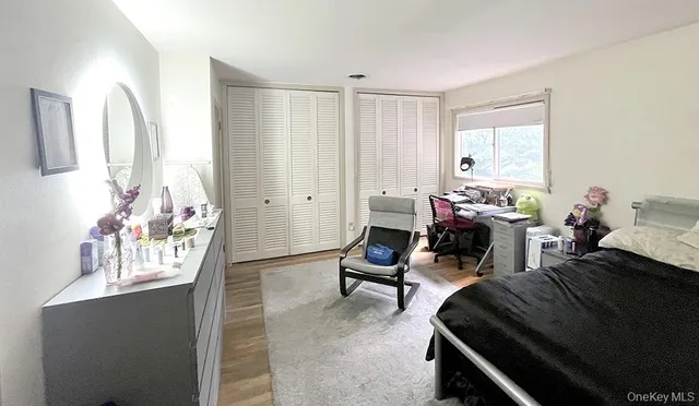 a bed room with a bed and a window