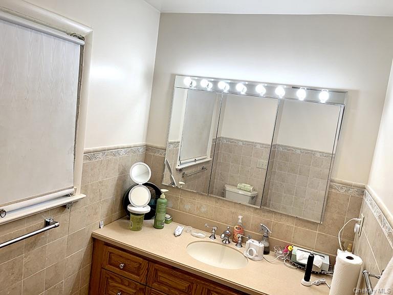 457 Quaker Ridge Road New Rochelle, NY 10804 - Photo 12 of 21 a bathroom with a sink and a mirror