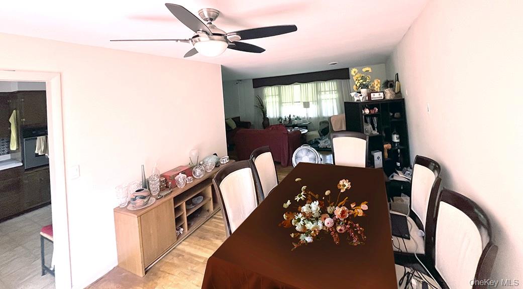 457 Quaker Ridge Road New Rochelle, NY 10804 - Photo 5 of 21 a view of a dining room with furniture and chandelier