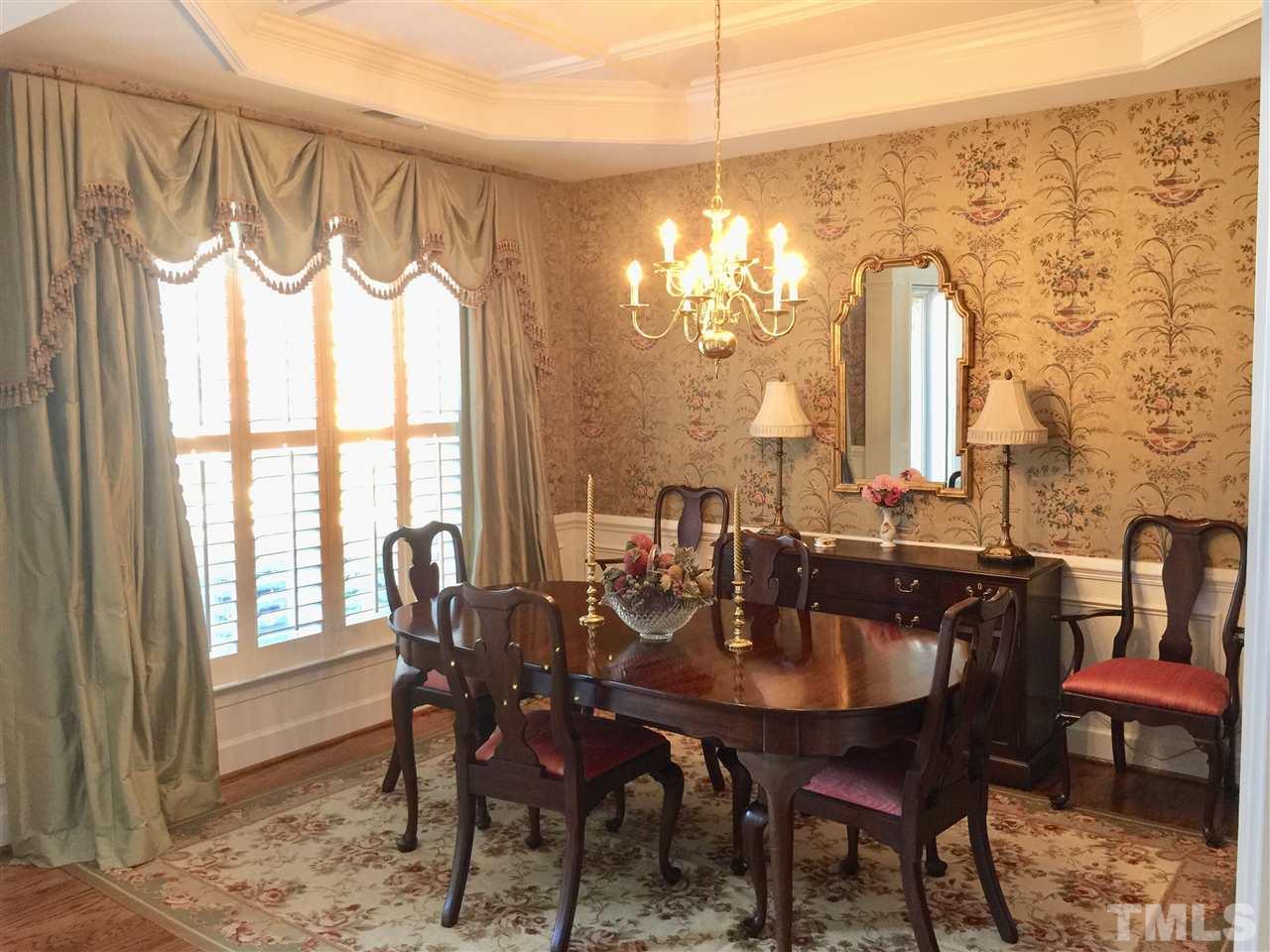 3900 Sunset Maple Court Raleigh, NC 27612 - Photo 2 of 20 Elegant dining room with tray ceiling, hardwood floors + heavy moulding