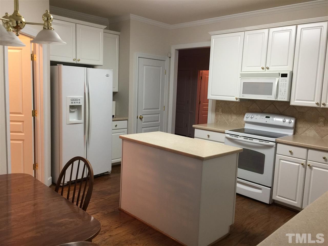 3900 Sunset Maple Court Raleigh, NC 27612 - Photo 6 of 20 Hardwood floors, refrigerator remains