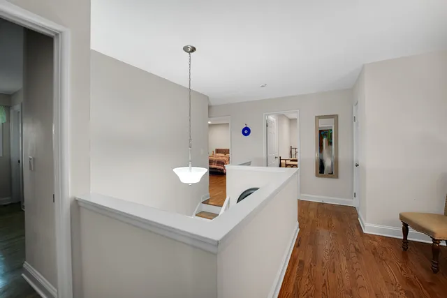 a view of kitchen island with furniture and wooden floor