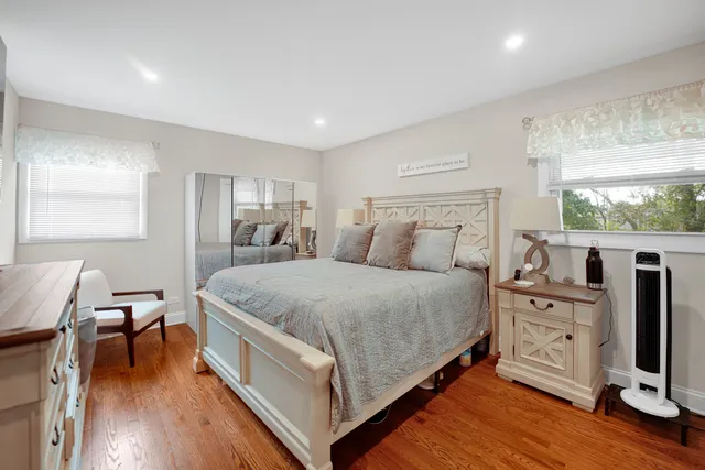 a bed room with a bed and a tv on the dresser