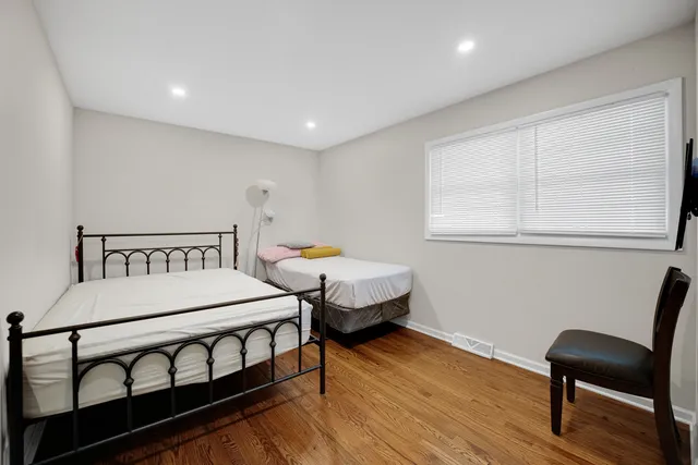 a bedroom with furniture and a window