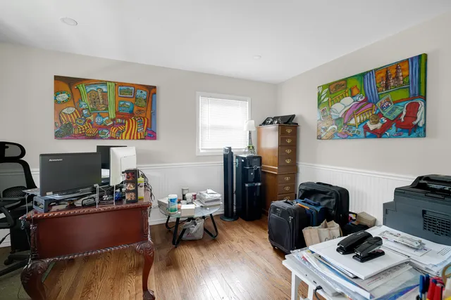 a room with furniture workspace and wooden floor