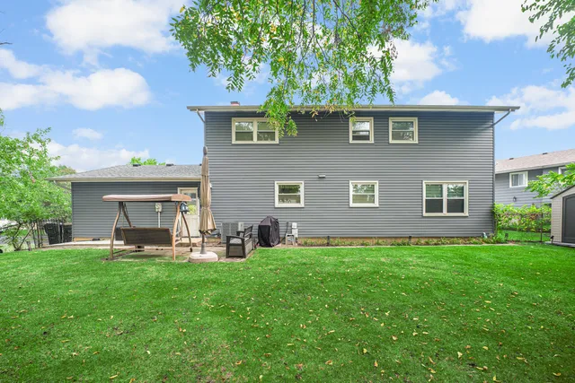a view of a house with a yard porch and sitting area