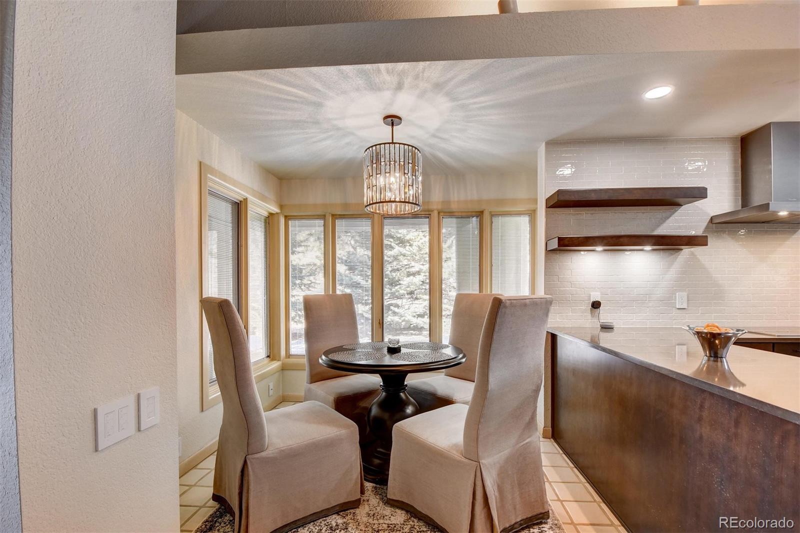 574 Spring Ranch Drive Golden, CO 80401 - Photo 12 of 40 a view of a dining room with furniture window and outside view