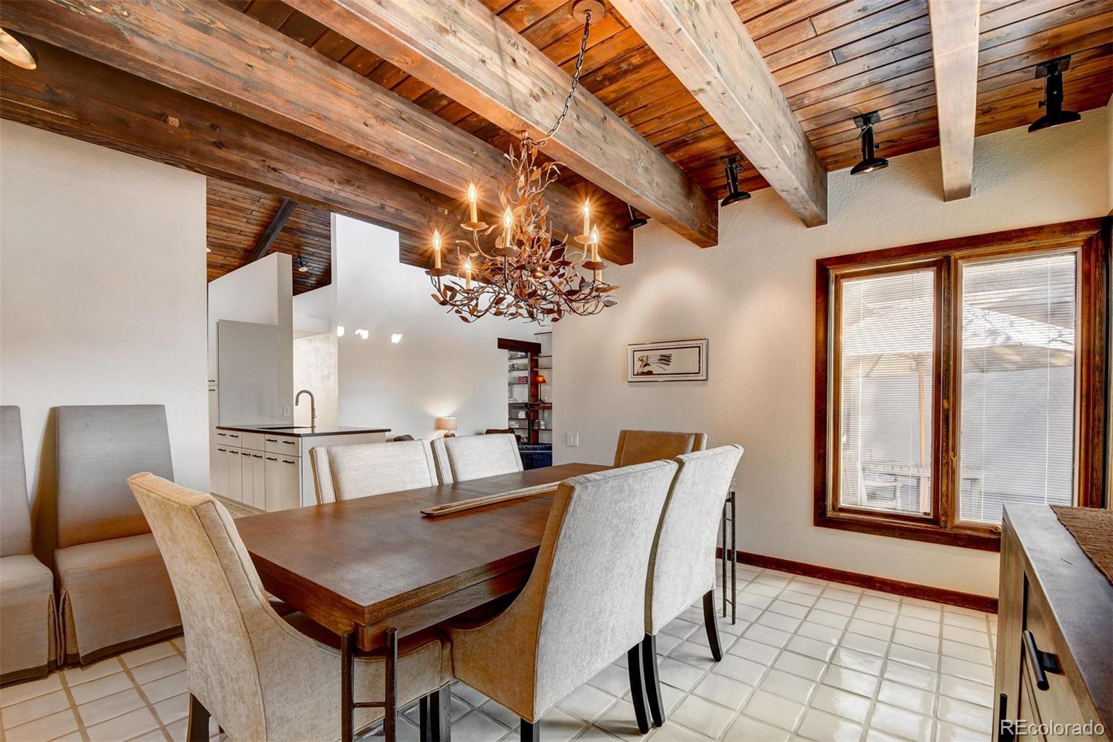 574 Spring Ranch Drive Golden, CO 80401 - Photo 15 of 40 a view of a dining room with furniture window and outside view