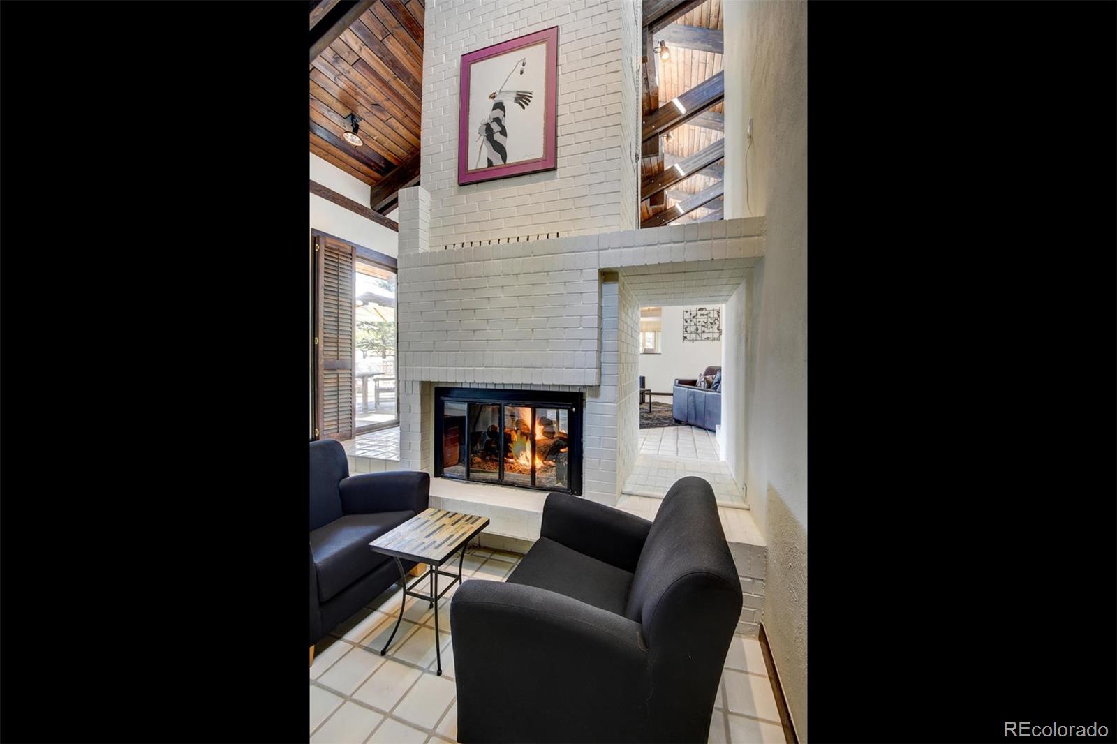 574 Spring Ranch Drive Golden, CO 80401 - Photo 17 of 40 a living room with furniture and a fireplace