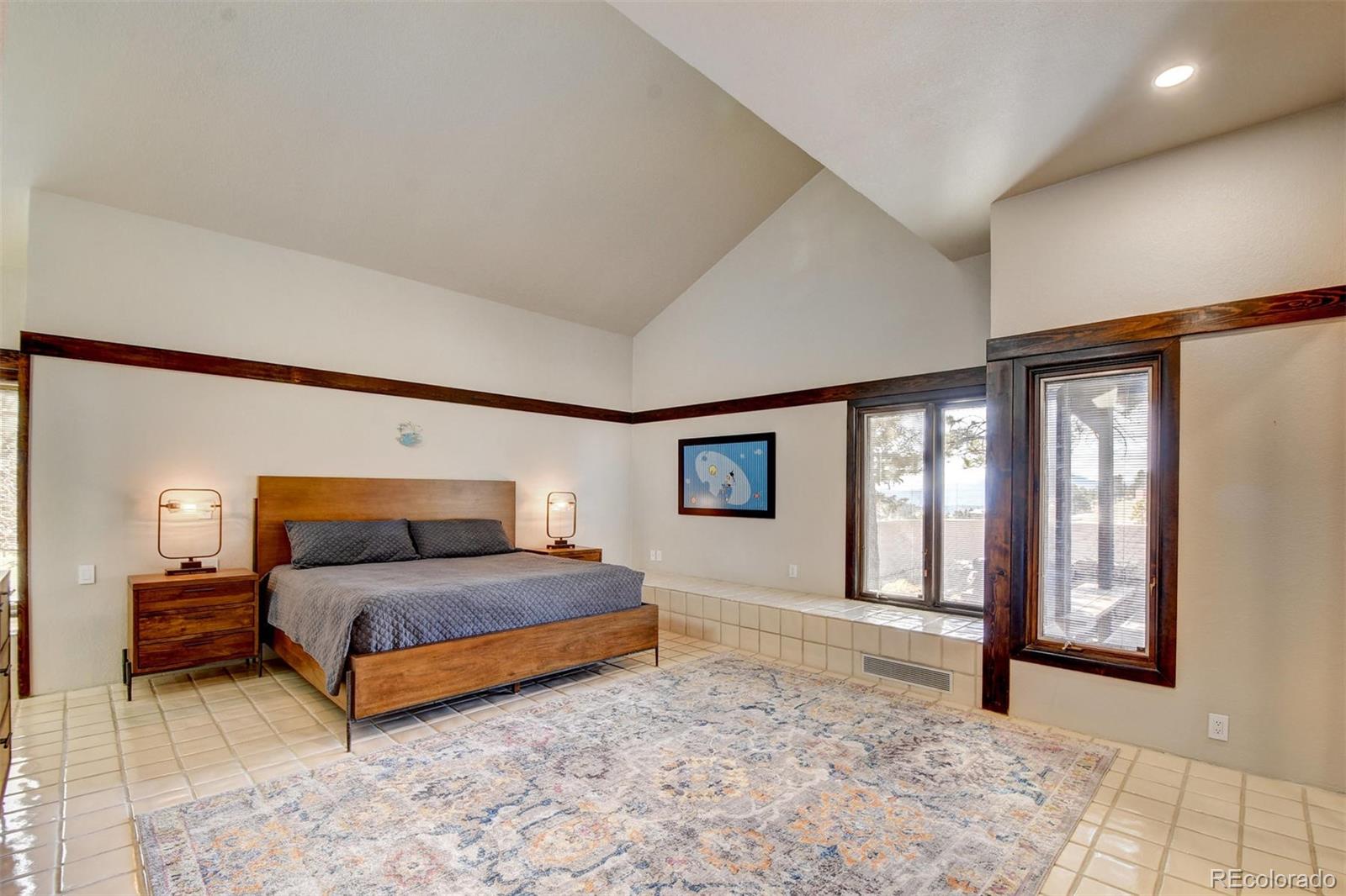 574 Spring Ranch Drive Golden, CO 80401 - Photo 18 of 40 a bedroom with a large bed and a window