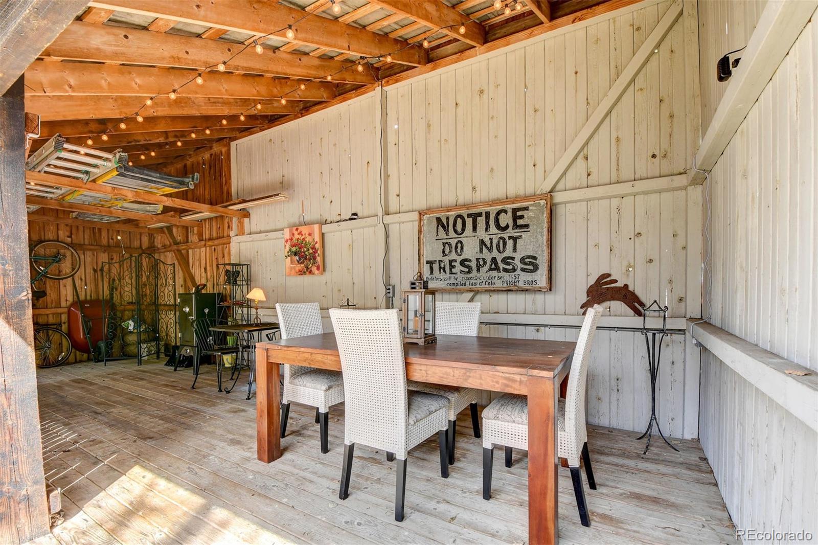 574 Spring Ranch Drive Golden, CO 80401 - Photo 28 of 40 a dinning table and chairs in a patio
