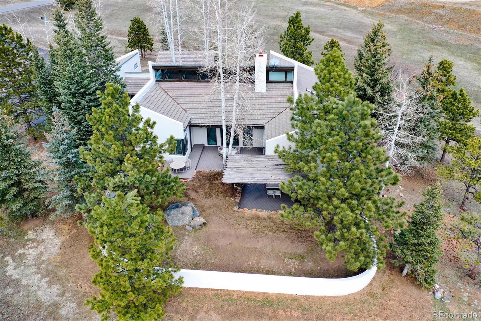 574 Spring Ranch Drive Golden, CO 80401 - Photo 35 of 40 an aerial view of a house with garden space and street view