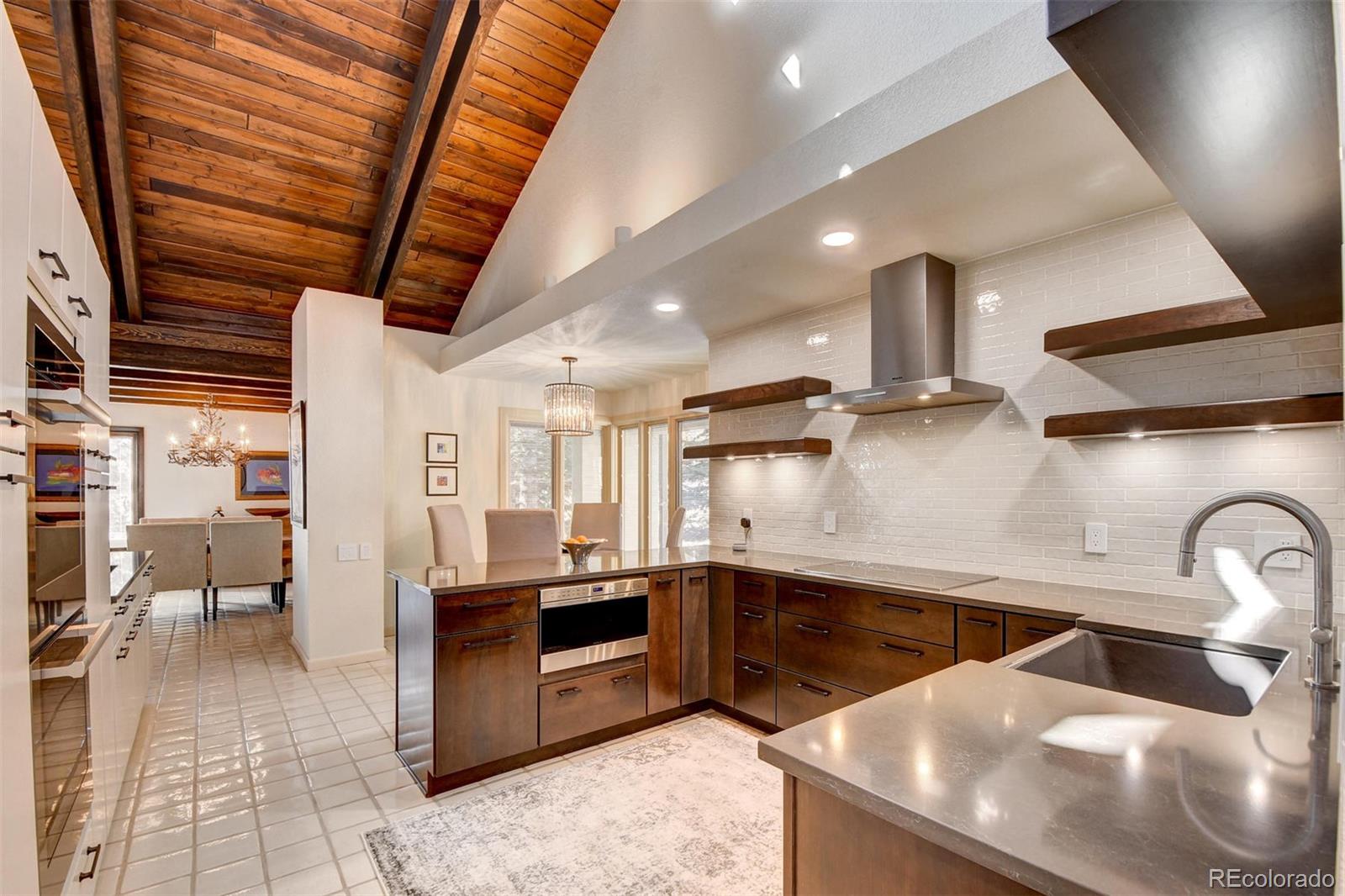574 Spring Ranch Drive Golden, CO 80401 - Photo 9 of 40 a kitchen with stainless steel appliances a sink a stove and a refrigerator