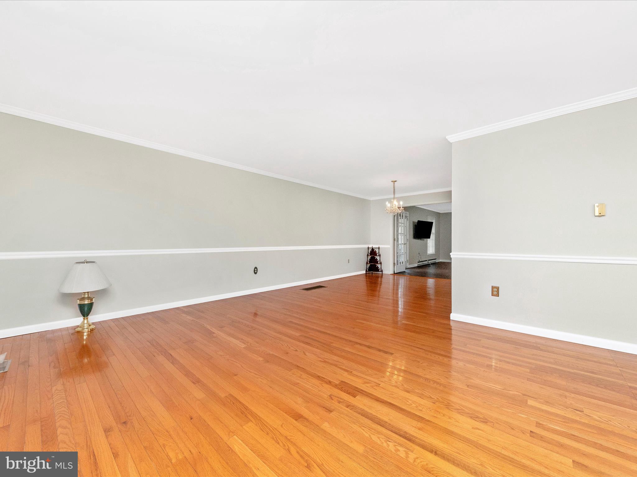 7801 Rocky Springs Road Frederick, MD 21702 - Photo 10 of 56 a view of empty room with wooden floor
