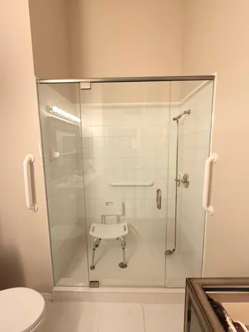 a bed sitting in a bedroom next to a large window