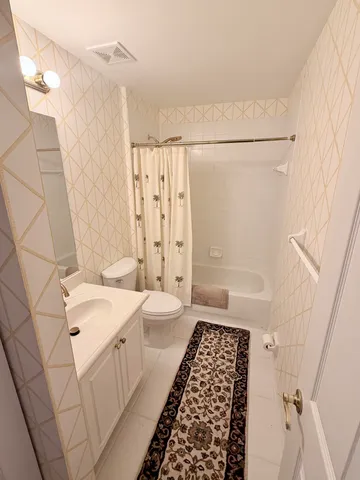 a view of a bench in front of a house