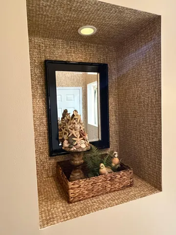 a view of a patio with table and chairs potted plants and palm trees