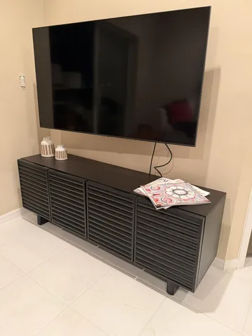 a view of a living room with furniture and a mirror