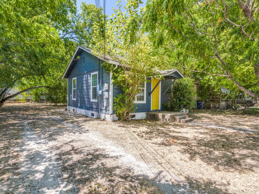 1136 Garland Avenue Austin, TX 78721 - Photo 21 of 24 a view of a house with a tree in the background