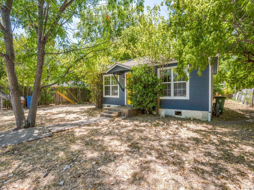 1136 Garland Avenue Austin, TX 78721 - Photo 23 of 24 a house with trees in front of it