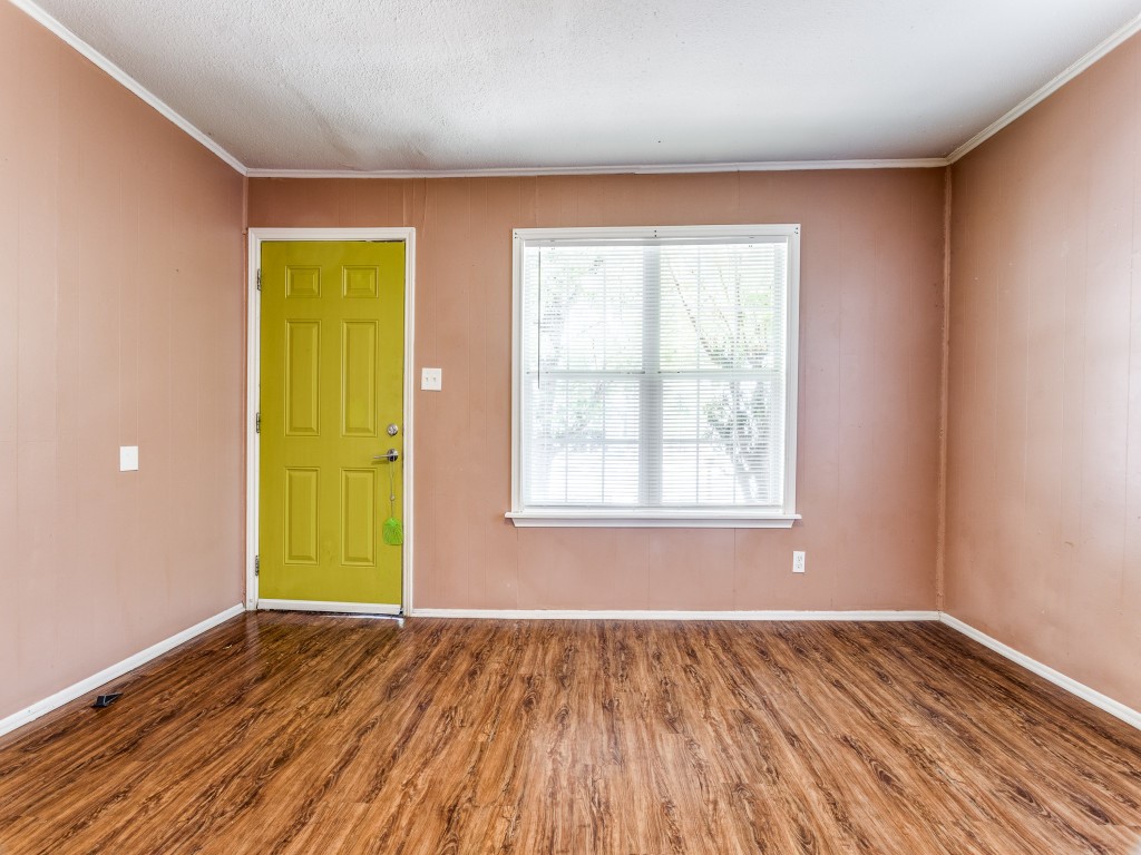 1136 Garland Avenue Austin, TX 78721 - Photo 5 of 24 wooden floor in an empty room with a window