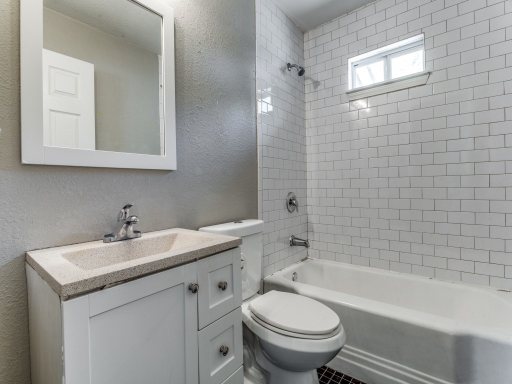 1136 Garland Avenue Austin, TX 78721 - Photo 6 of 24 a bathroom with a sink toilet and shower