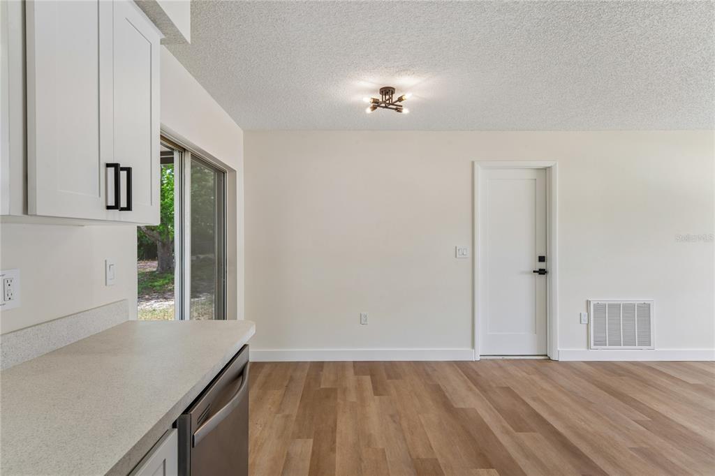 10194 Gamewell Street Spring Hill, FL 34608 - Photo 13 of 36 a view of an empty room with a window