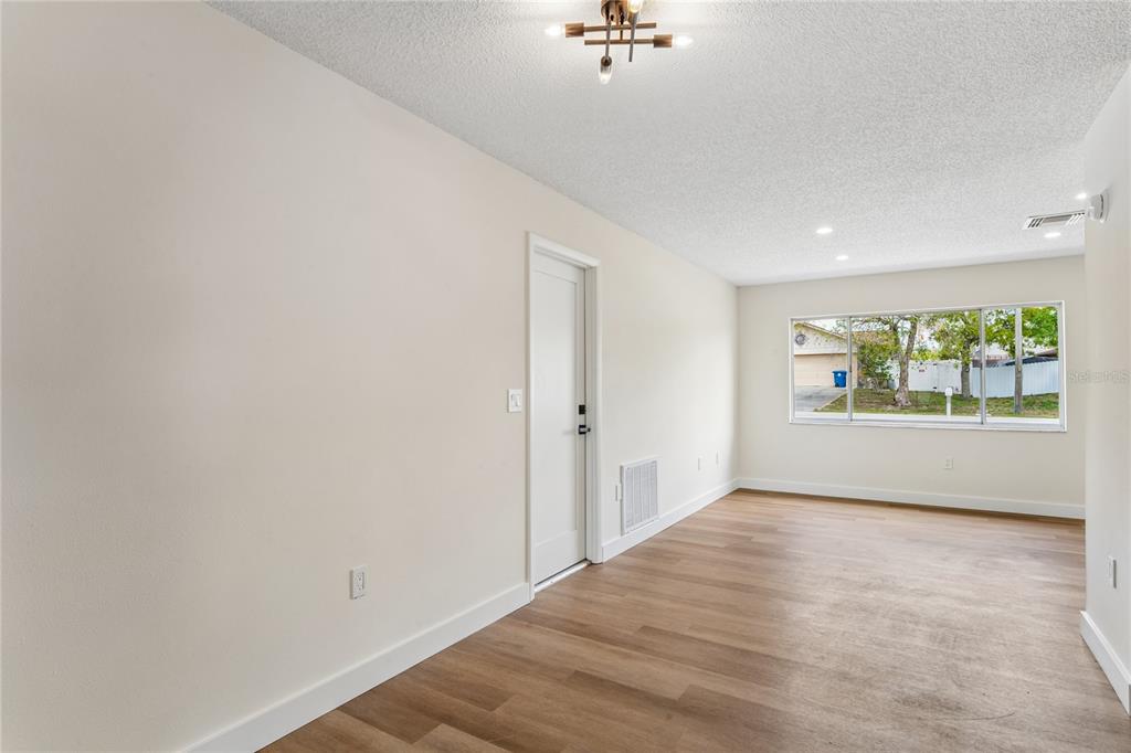 10194 Gamewell Street Spring Hill, FL 34608 - Photo 15 of 36 a view of an empty room with a window