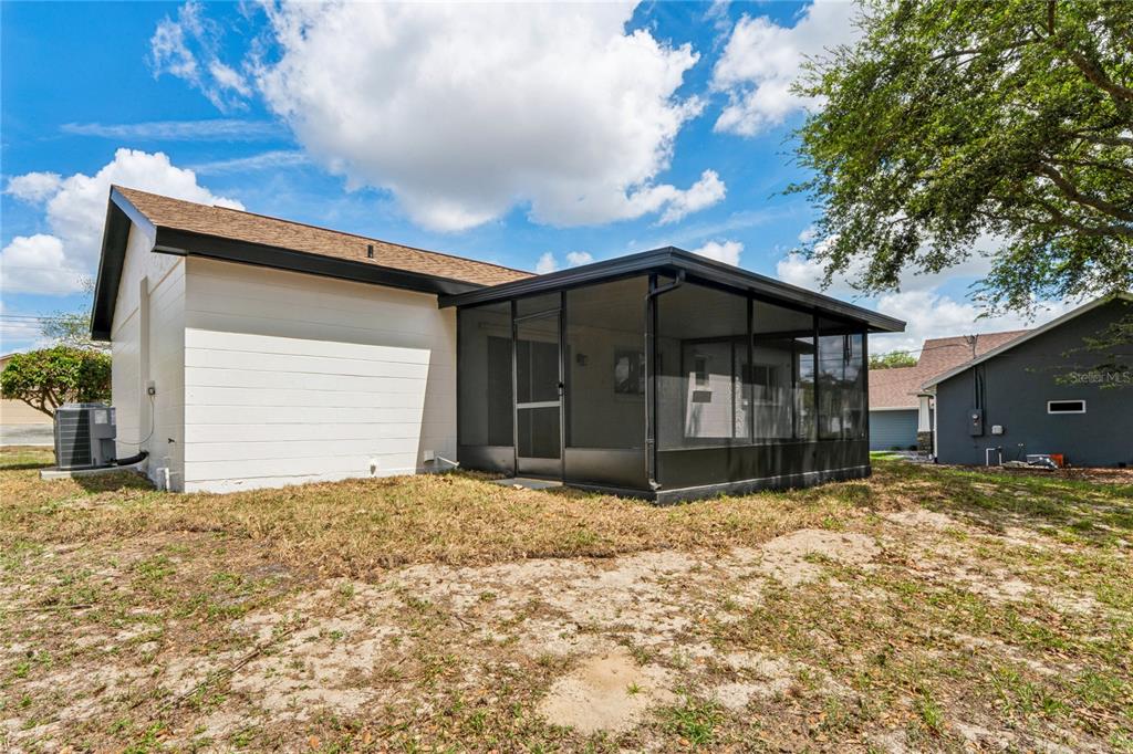 10194 Gamewell Street Spring Hill, FL 34608 - Photo 26 of 36 a house with yard in front of it