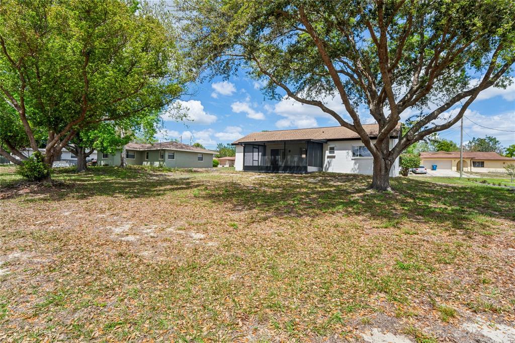 10194 Gamewell Street Spring Hill, FL 34608 - Photo 28 of 36 a front view of a house with a yard