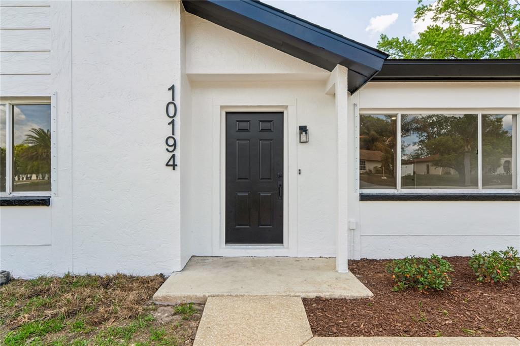 10194 Gamewell Street Spring Hill, FL 34608 - Photo 3 of 36 a view of a door of the house
