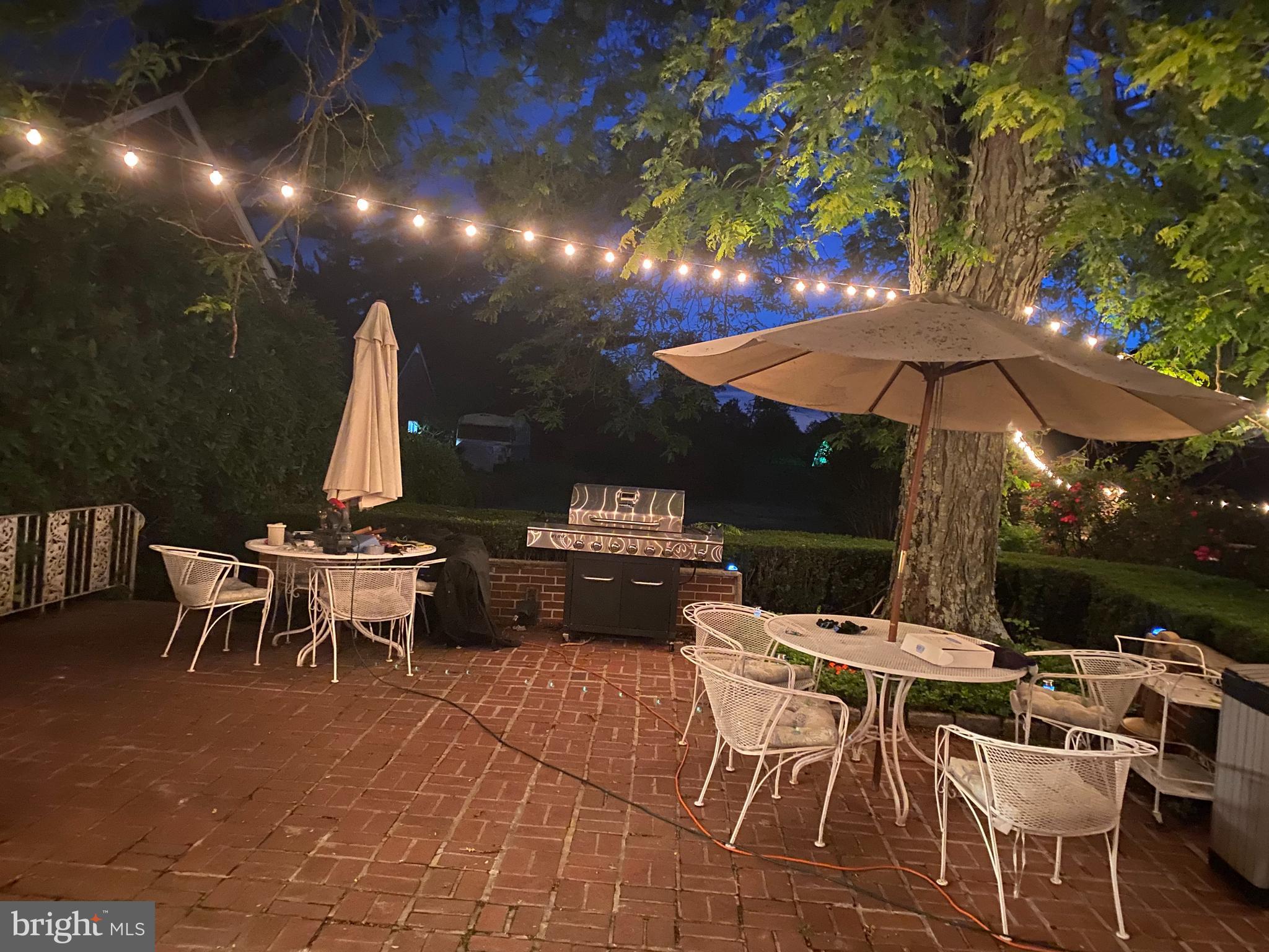1591 Middletown Road Glen Mills, PA 19342 - Photo 36 of 55 a view of a patio with a dining table and chairs under an umbrella with a barbeque grill and couches
