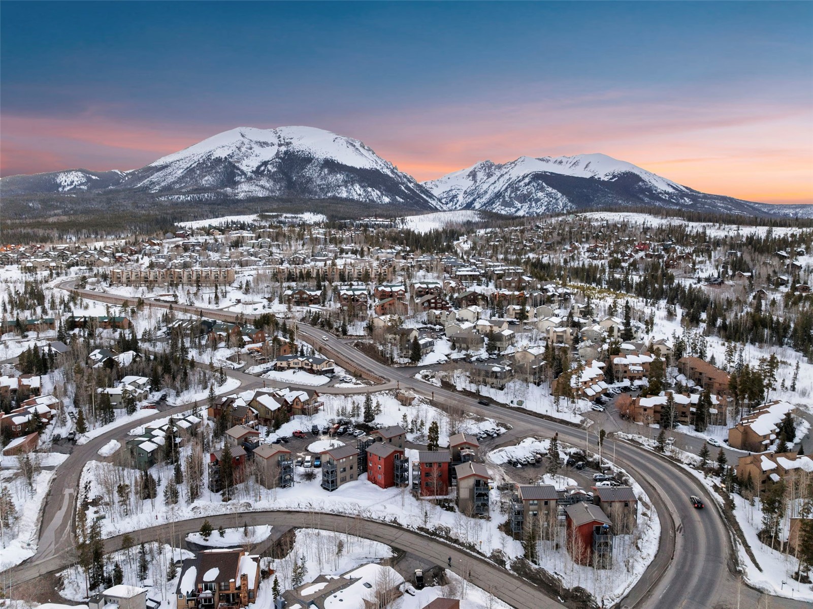 8015 Ryan Gulch Road, Unit B6 Silverthorne, CO 80498 - Photo 35 of 35 Snowy aerial view with a mountain view and a residential view