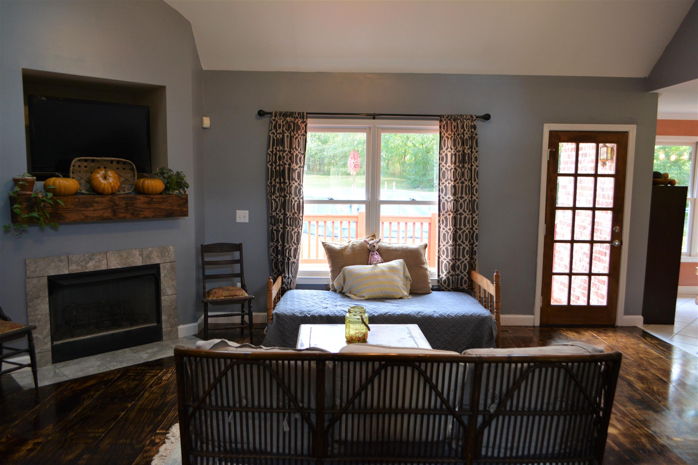 657 Earl Warren Road Beechgrove, TN 37018 - Photo 3 of 26 Nice open living room with hardwood floors and fireplace to keep warm.