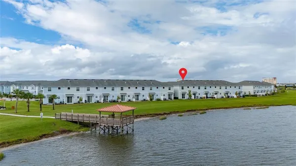 a view of a swimming pool and a yard