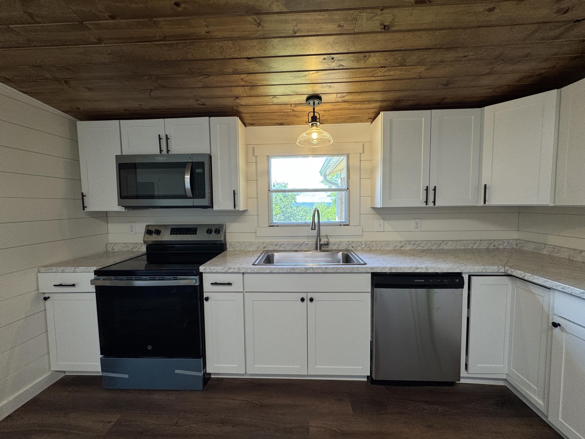 675 Ware Lane Georgetown, TN 37336 - Photo 13 of 24 a kitchen with a sink a stove and cabinets